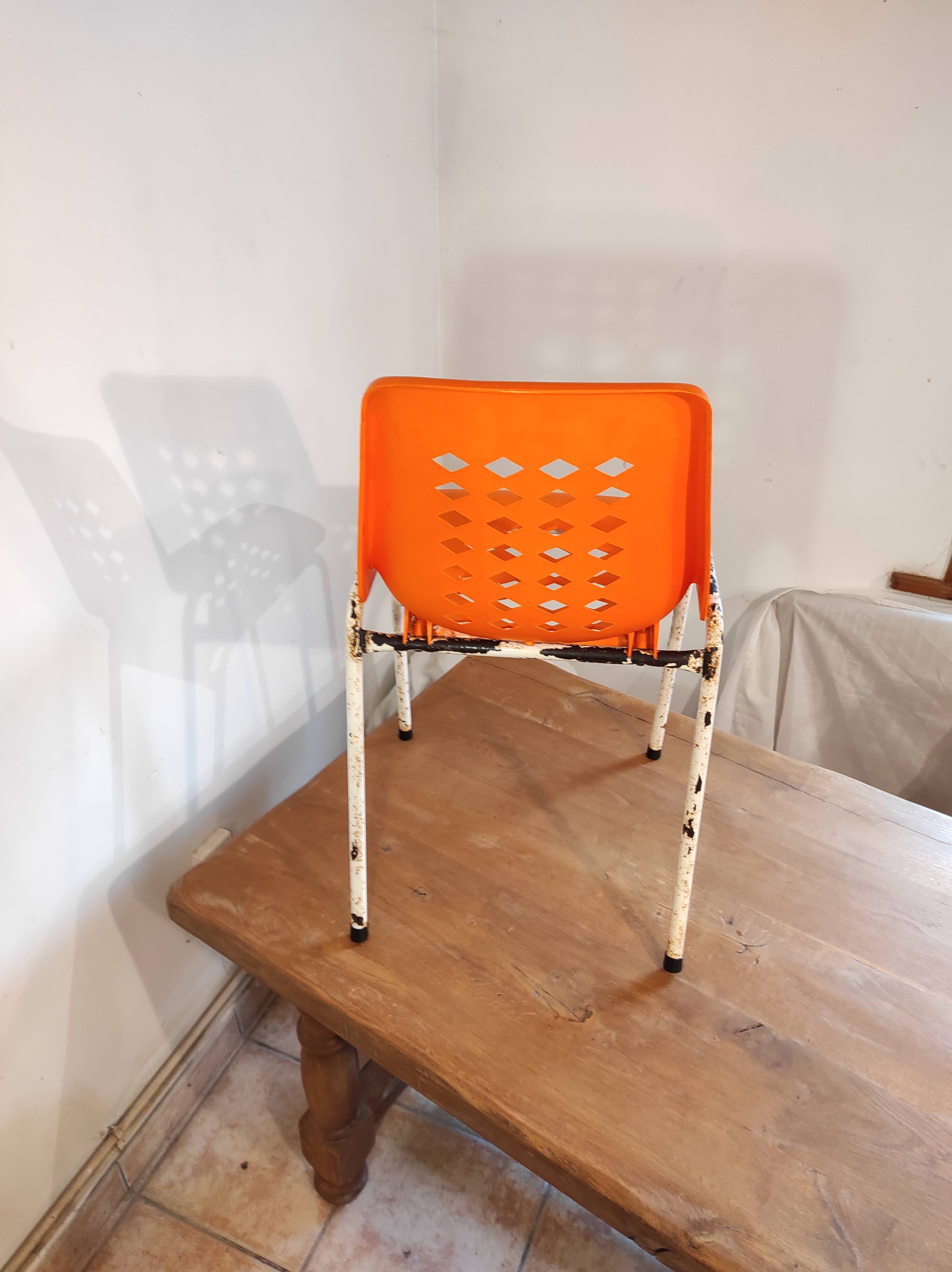 Chair with openwork plastic shell 1970