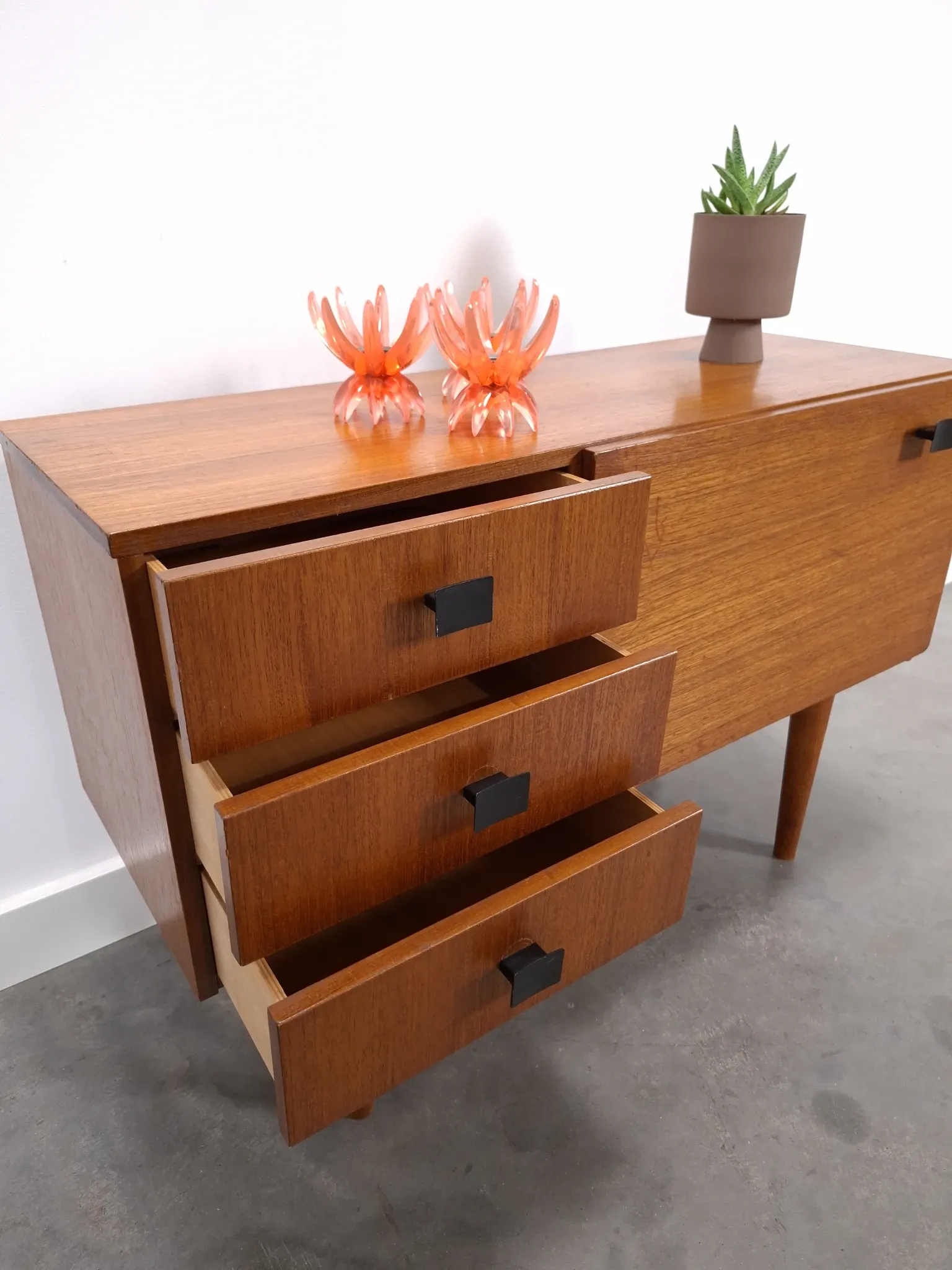 Vintage small teak cabinet with drawers, flap and black handles, hallway cabinet.
