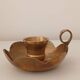 Brass candle holder in the shape of a flower.