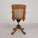 Oak office chair with adjustable spring system and height adjustment, 1950s.