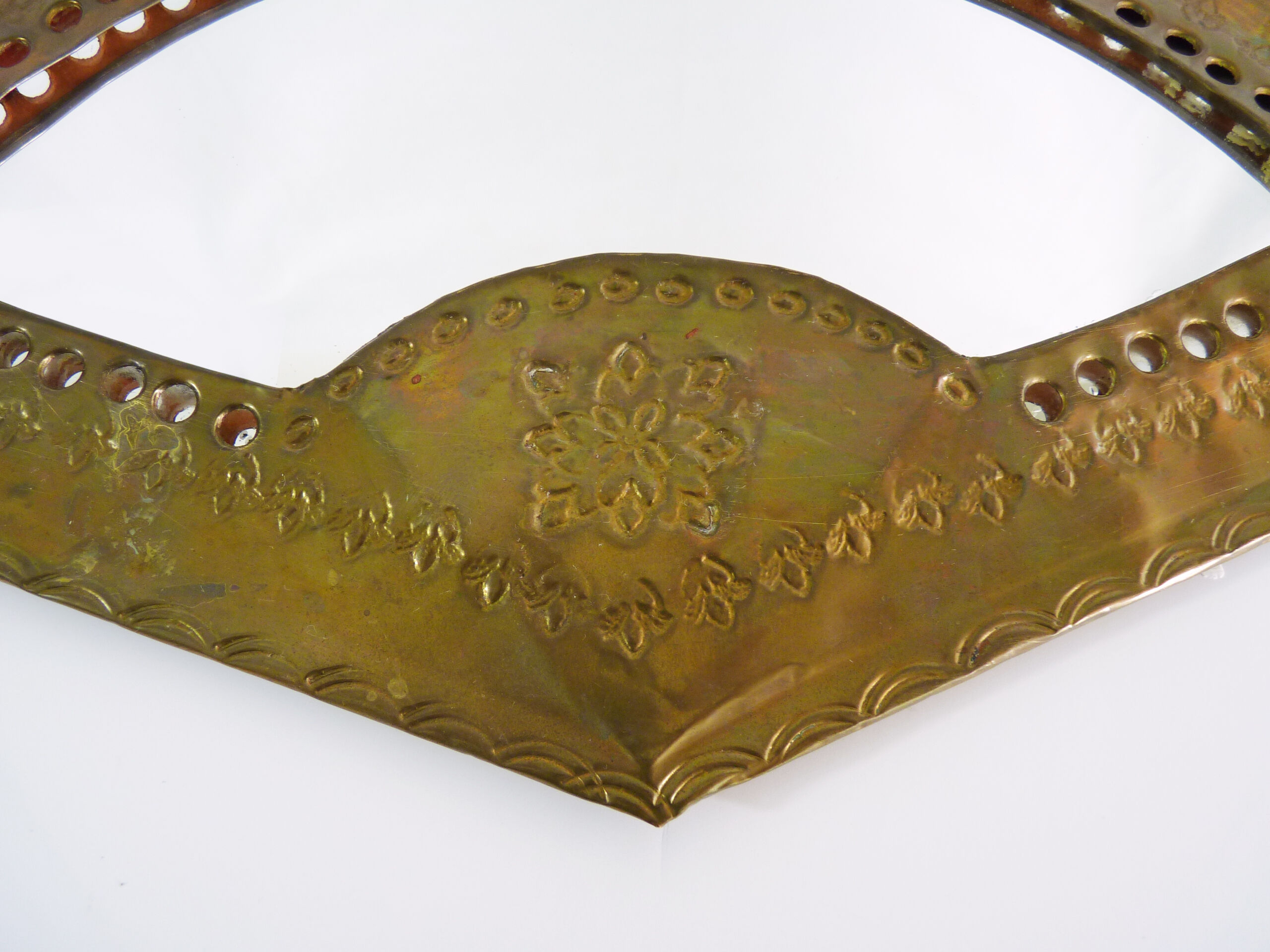 Old wall mirror in the shape of a copper fan pushed back, year 70