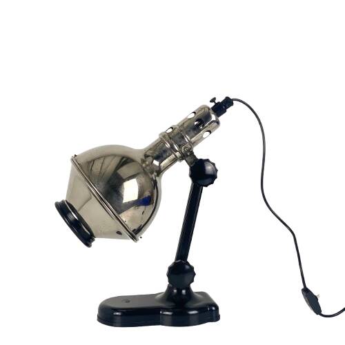 Directional articulated lamp in nickel-plated chrome and black bakelite, with cast iron counterweight.