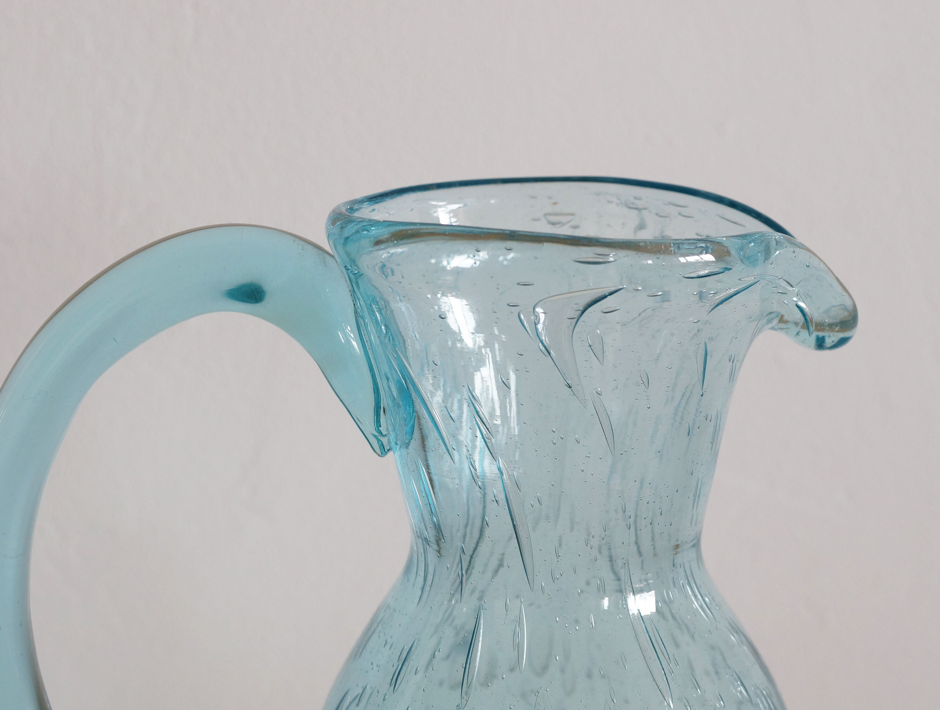 Blue carafe in bubble blown glass