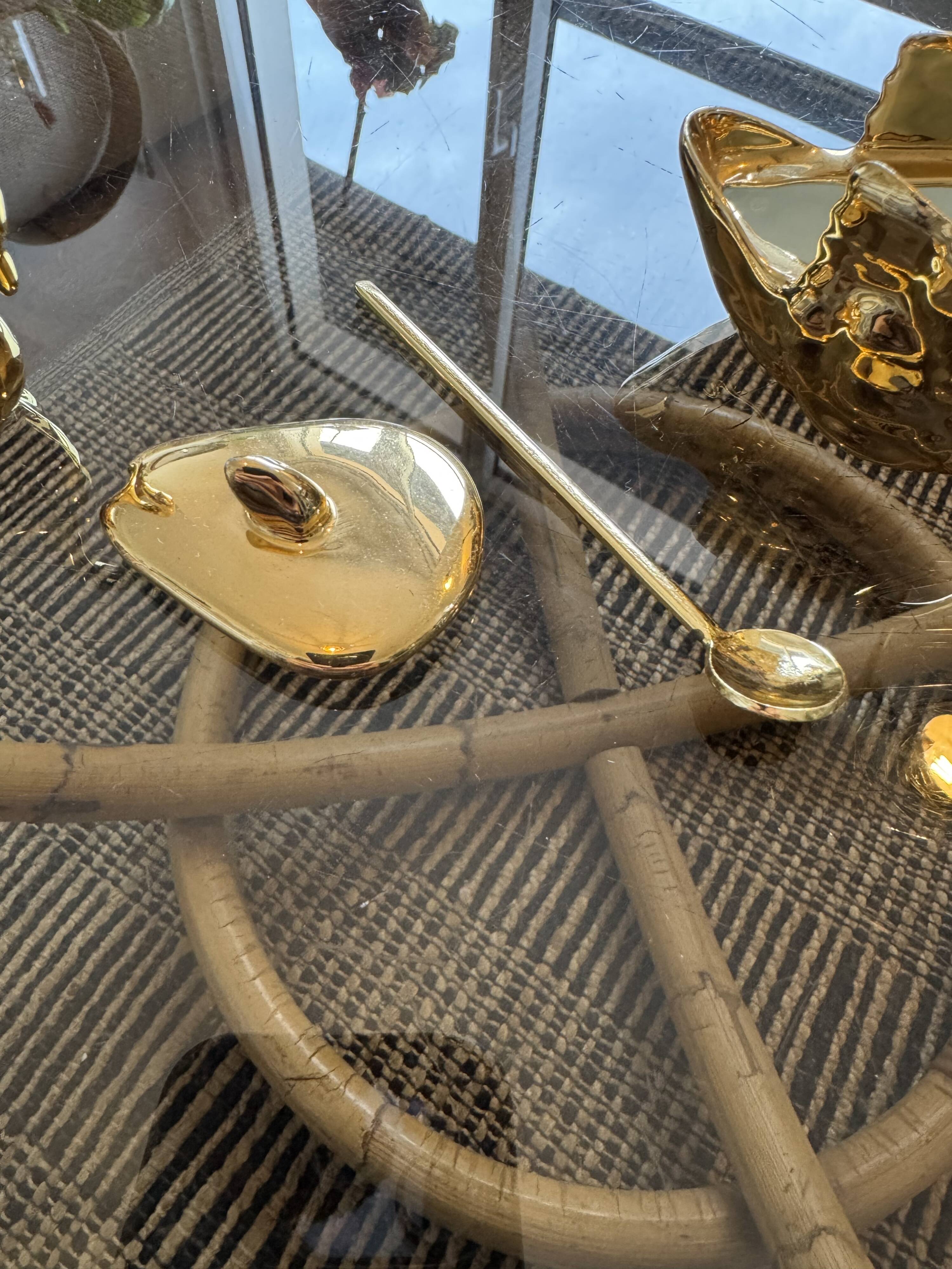 Pair of golden salt cellars in Limoges porcelain shaped like swans