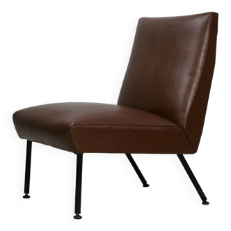 Low chair, circa 1950. Brown imitation leather.