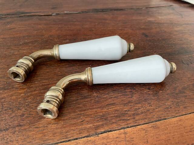 pair of Limoges porcelain door handles and brass