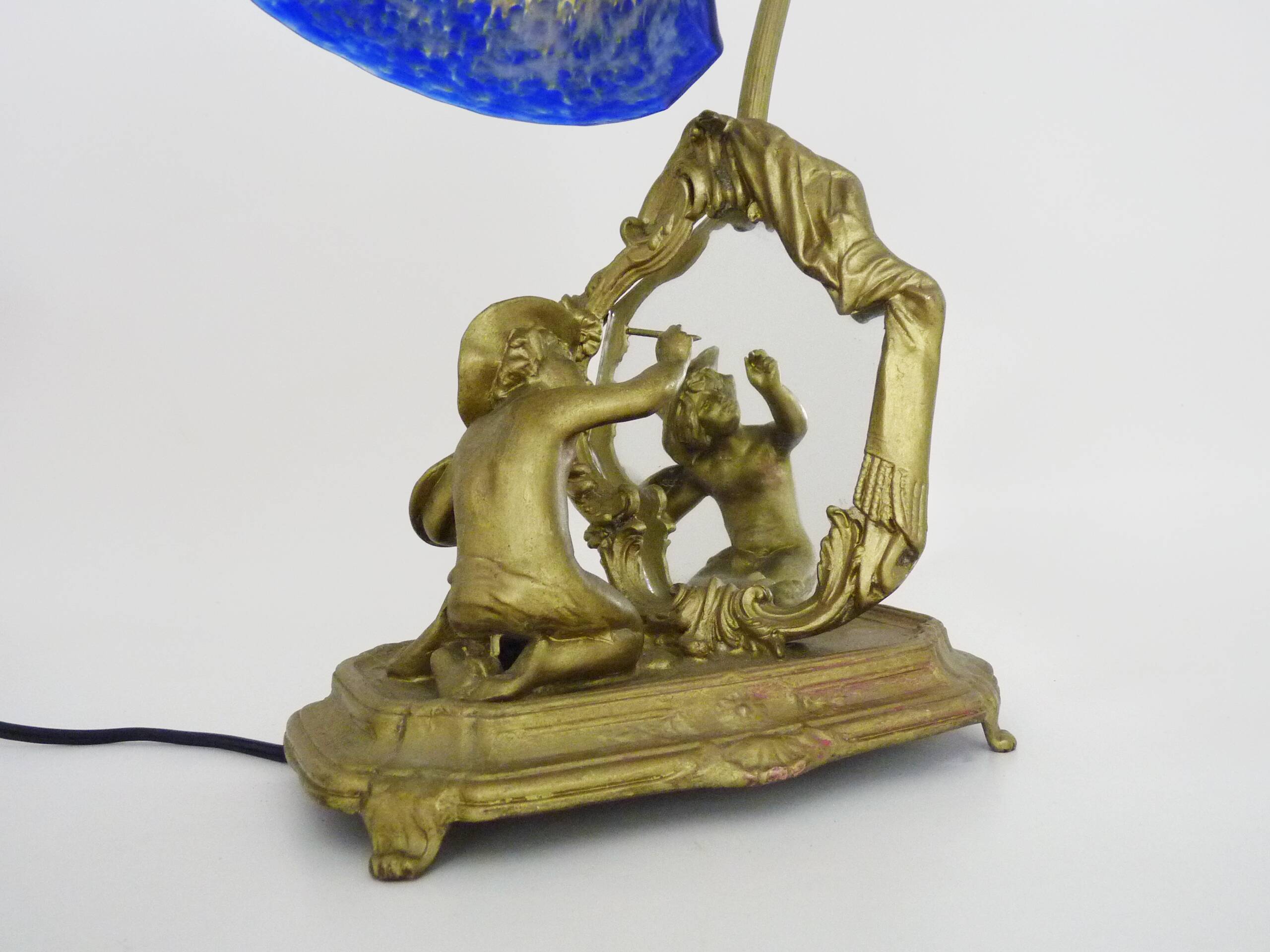 Vintage bronze table lamp featuring a painter on a mirror from the 1960s.