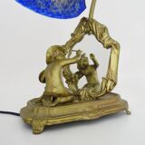 Vintage bronze table lamp featuring a painter on a mirror from the 1960s.