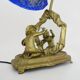 Vintage bronze table lamp featuring a painter on a mirror from the 1960s.