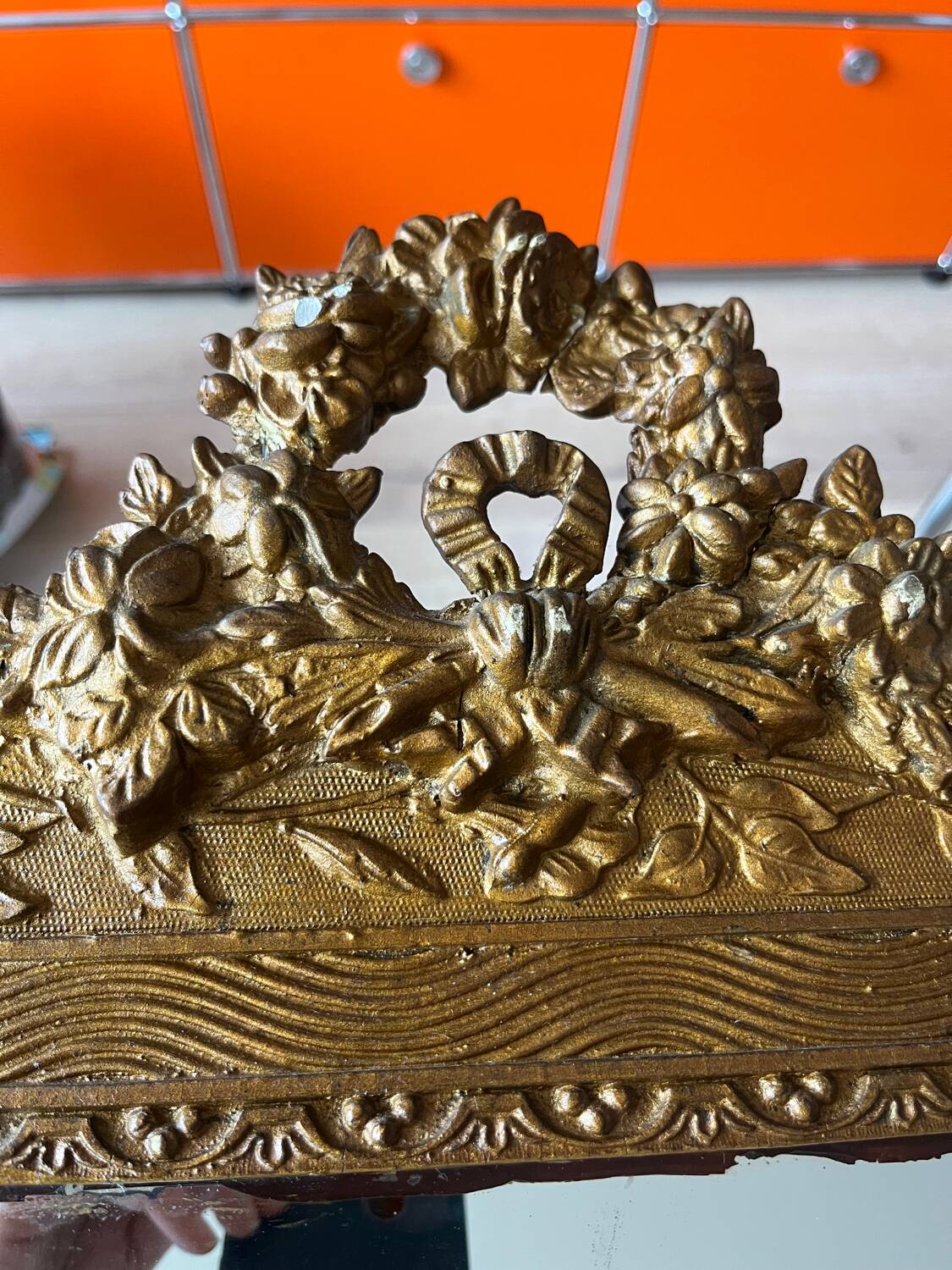 Golden trumeau mirror for fireplace, late 19th century, with sculpted pediment.