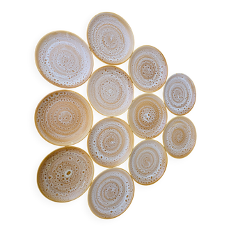 Set of 12 flat plates in stoneware Niderviller model Fauve from the 1960s.