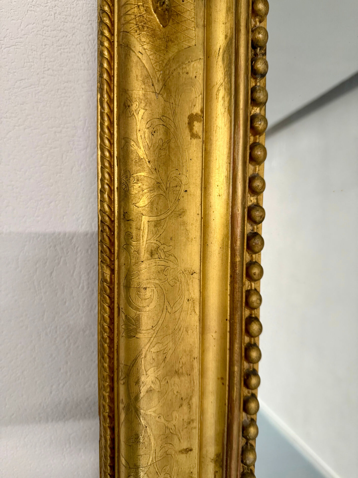 Large Napoleon III mirror with wooden gilded frame, 19th century, 200 cm.