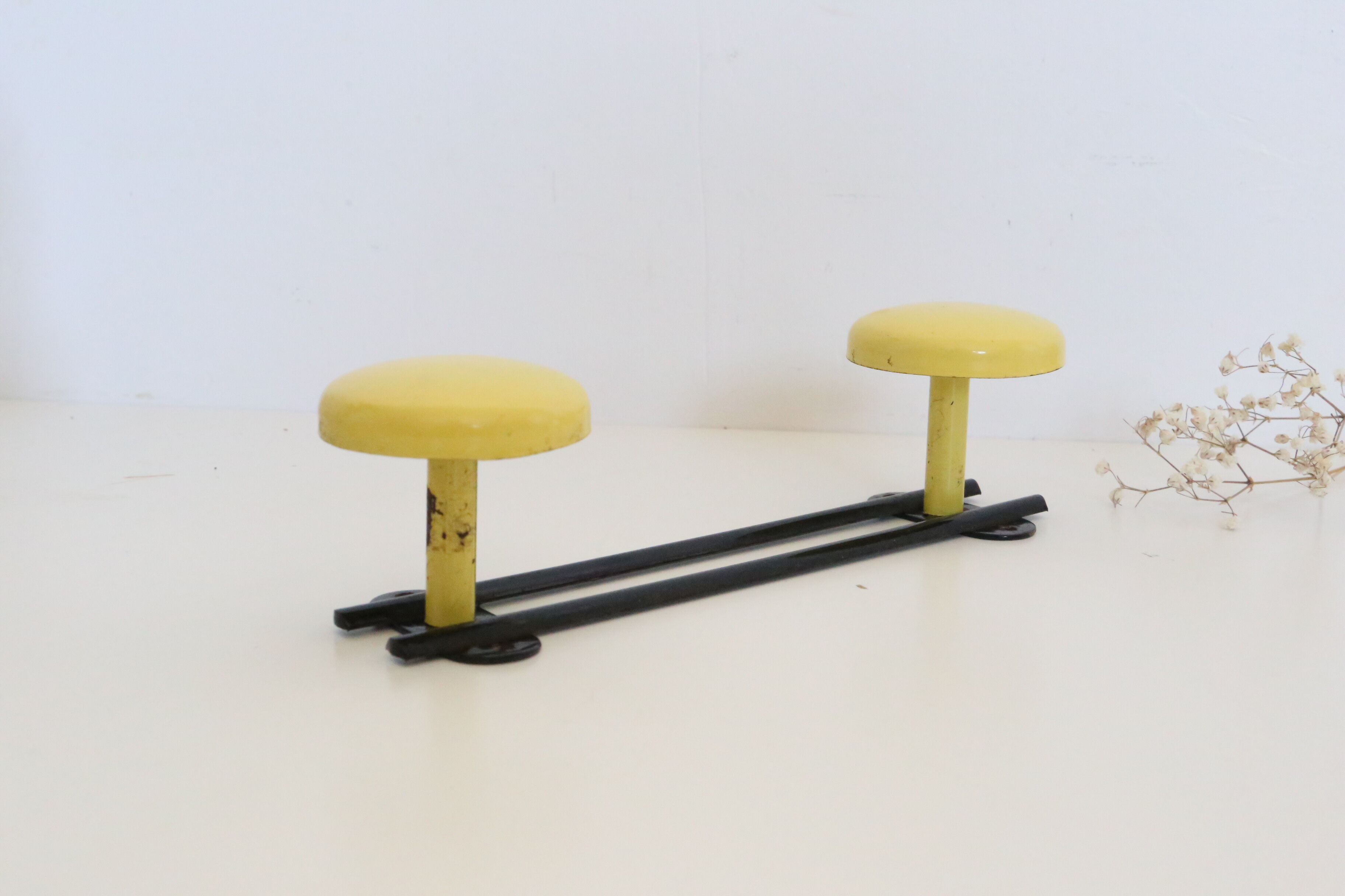 Wall coat rack in yellow and black metal, vintage