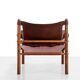 Deux fauteuils Arne Norell Sirocco en palissandre et cuir.