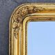 Large Biedermeier gilded mirror in faceted wood, circa 1840.
