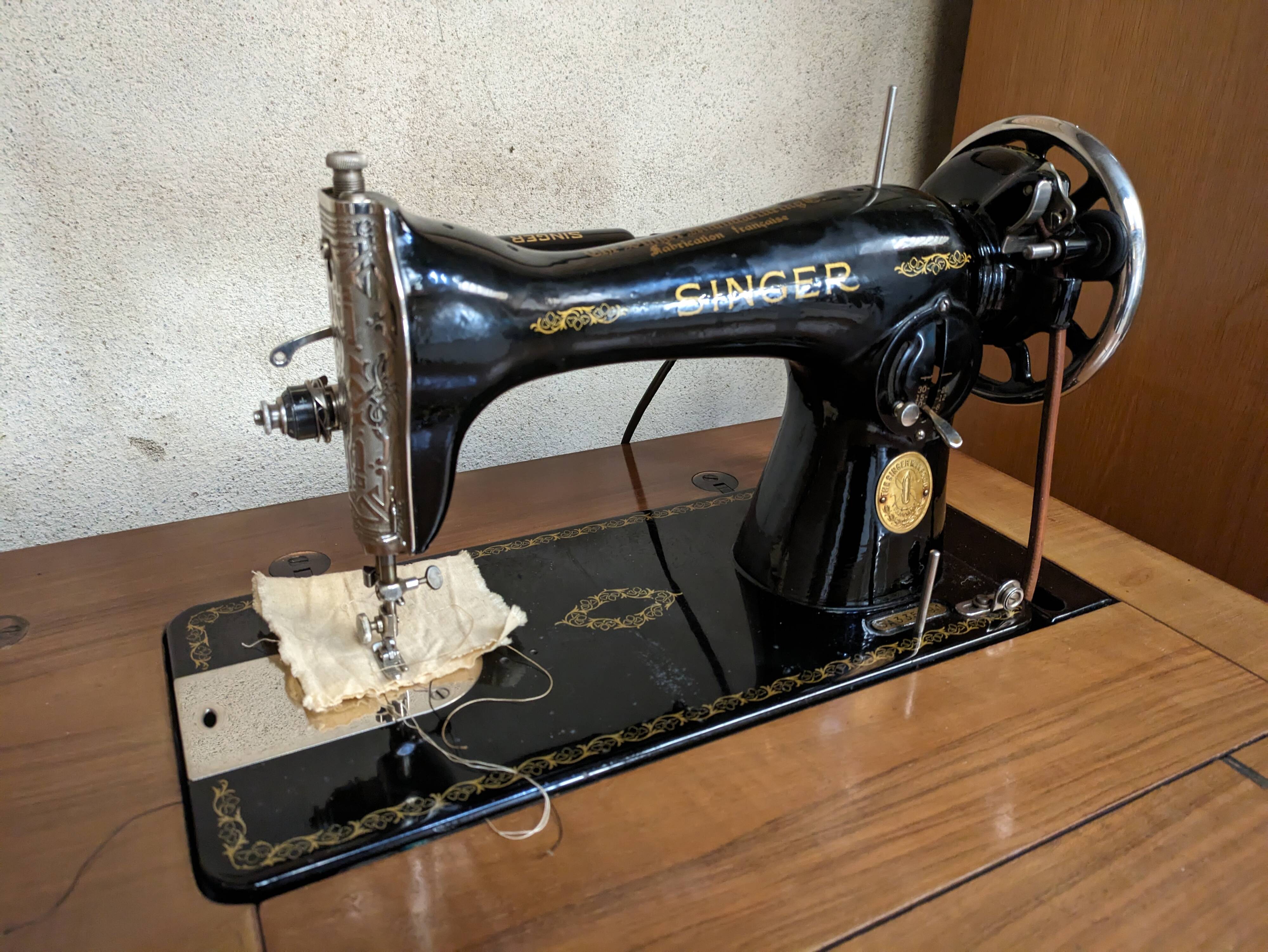 Singer sewing machine in its cabinet