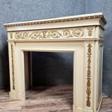 Louis XVI fireplace made in the 19th century, all in lacquered and gilded wood with decorative attributes