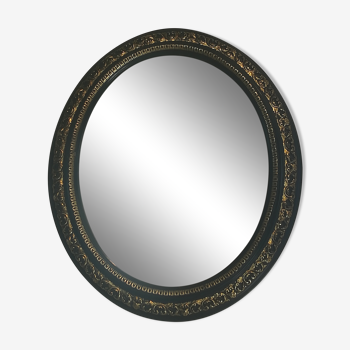 Miroir ovale Napoléon III laqué noir et doré