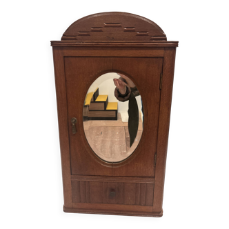 Wall cabinet with oval wall and drawer