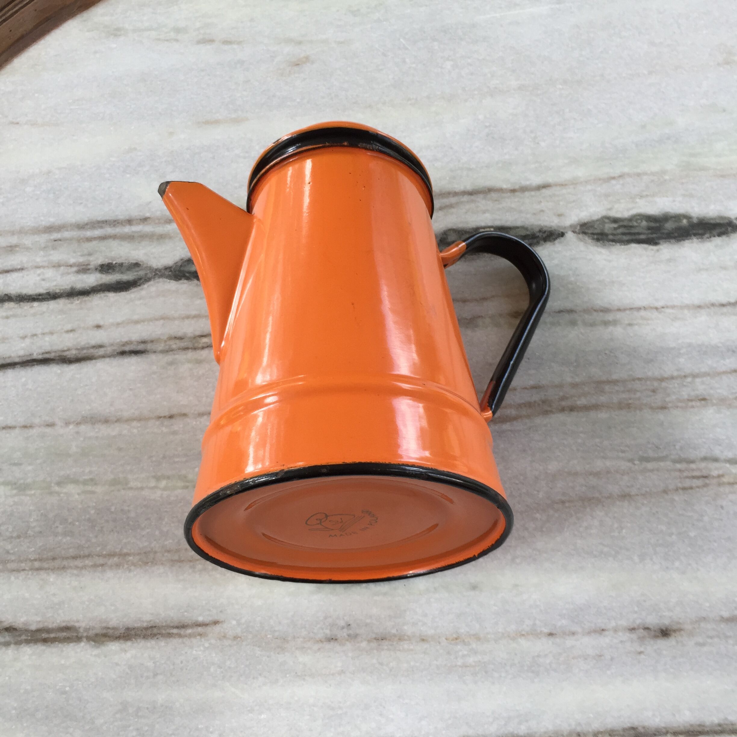 Orange and black enamelled sheet metal coffee maker