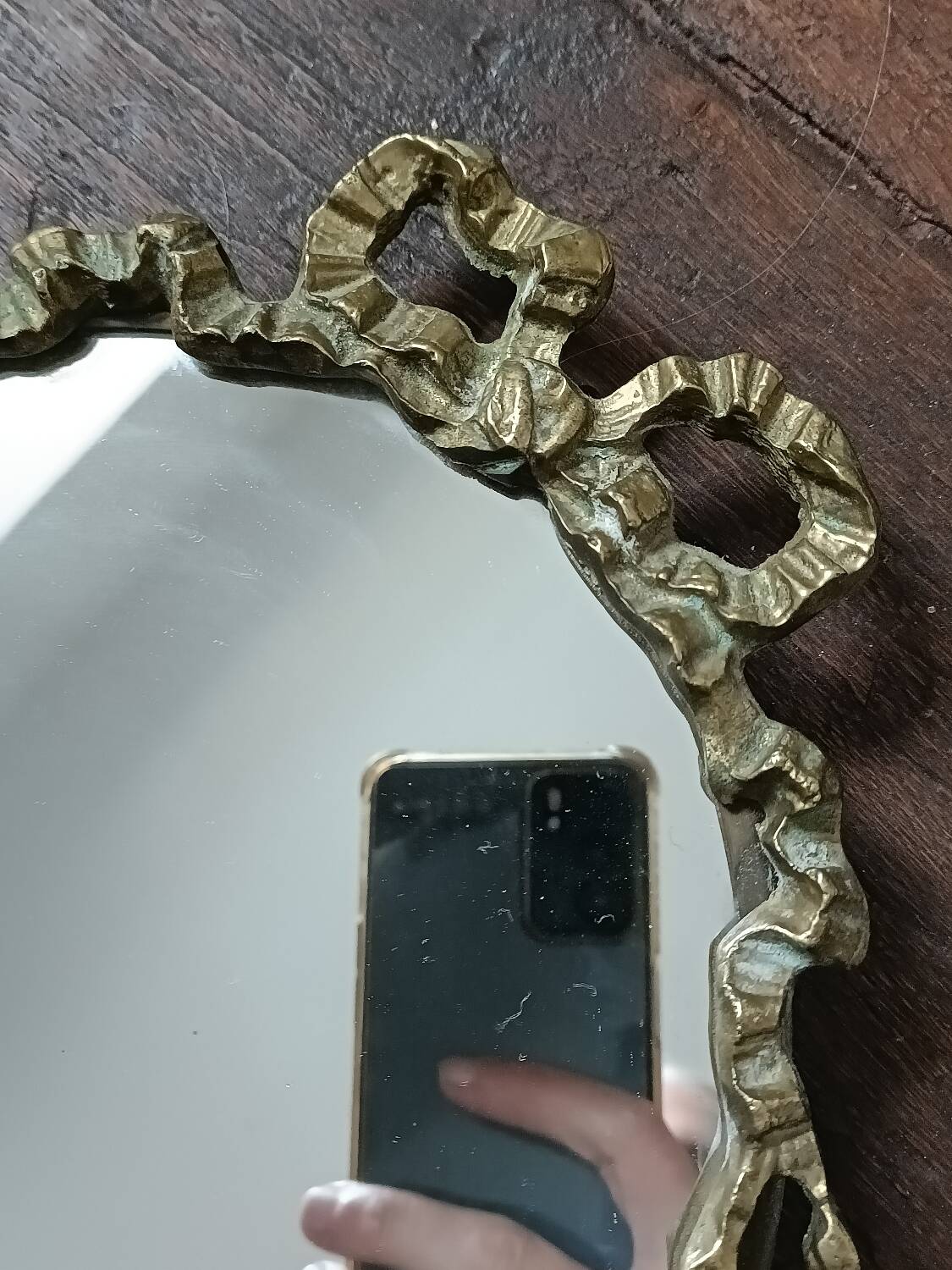 Antique mirror, oval with brass crest