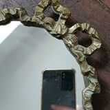 Antique mirror, oval with brass crest
