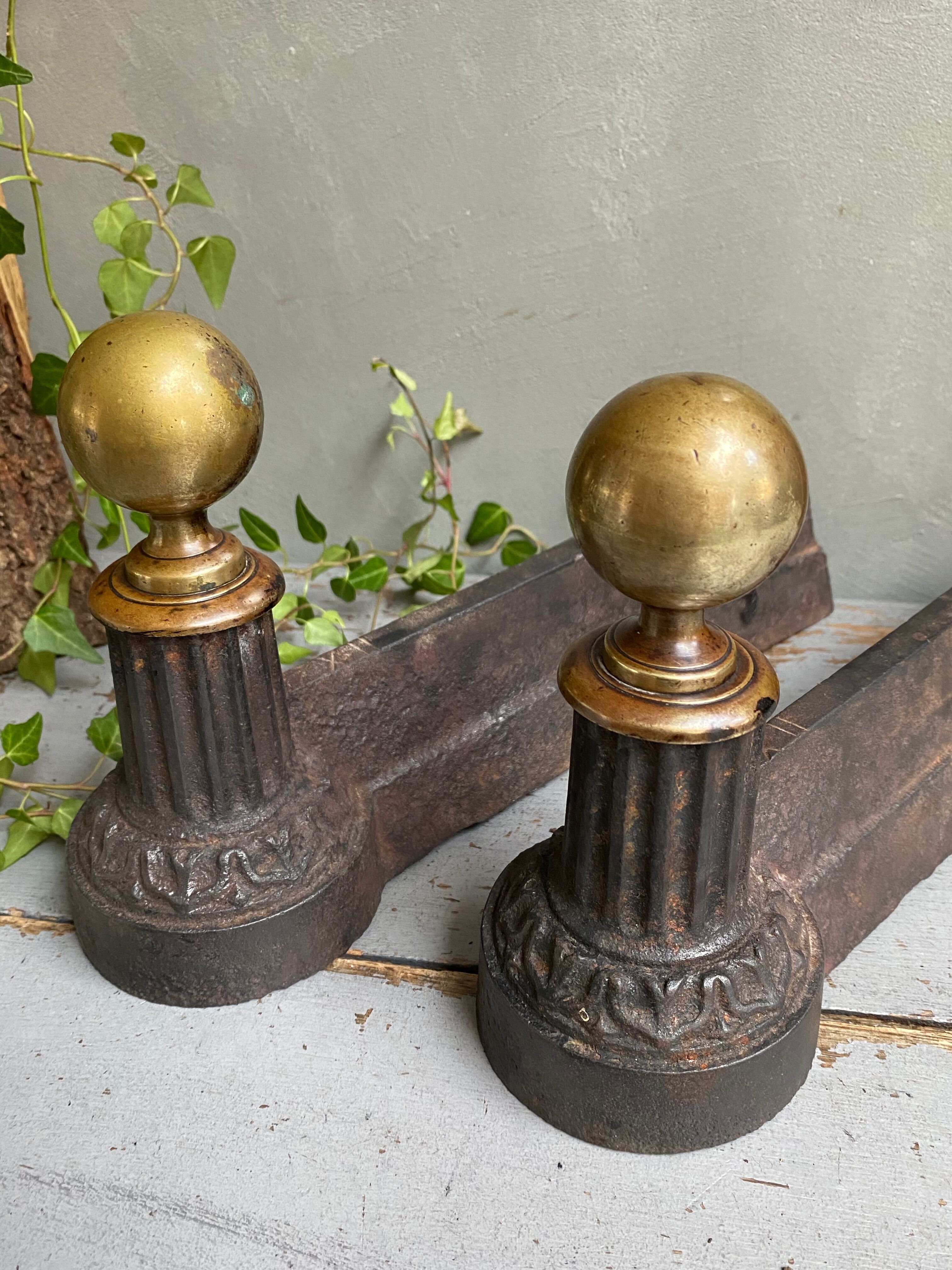 Pair of cast iron and brass chenets