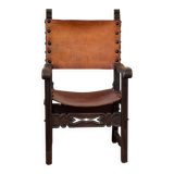 Frailero armchair, antique Spanish — carved wood & full-grain leather.