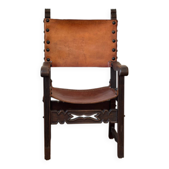 Frailero armchair, antique Spanish — carved wood & full-grain leather.