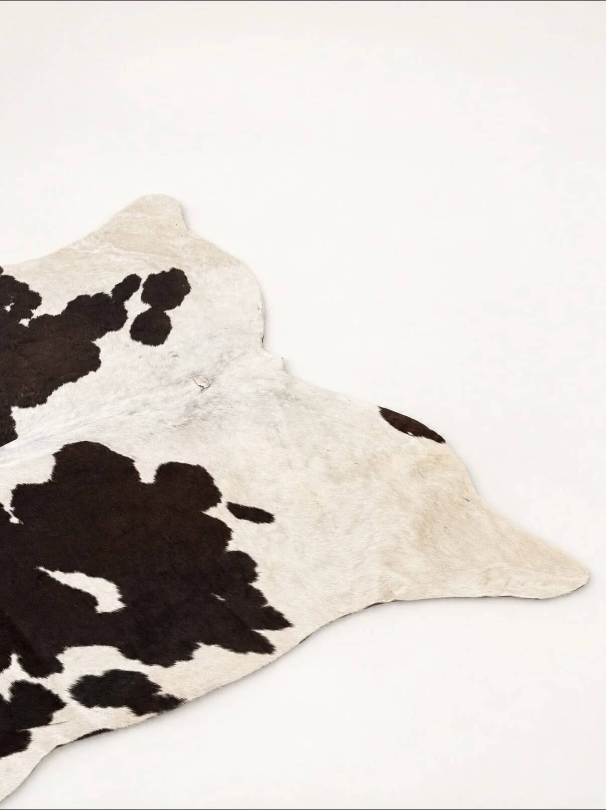 Tapis en peau de vache véritable noir et blanc