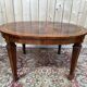 Extendable oval table in Louis XVI style – Walnut and Burl Marquetry