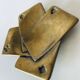 Empty pocket square of aces in brass