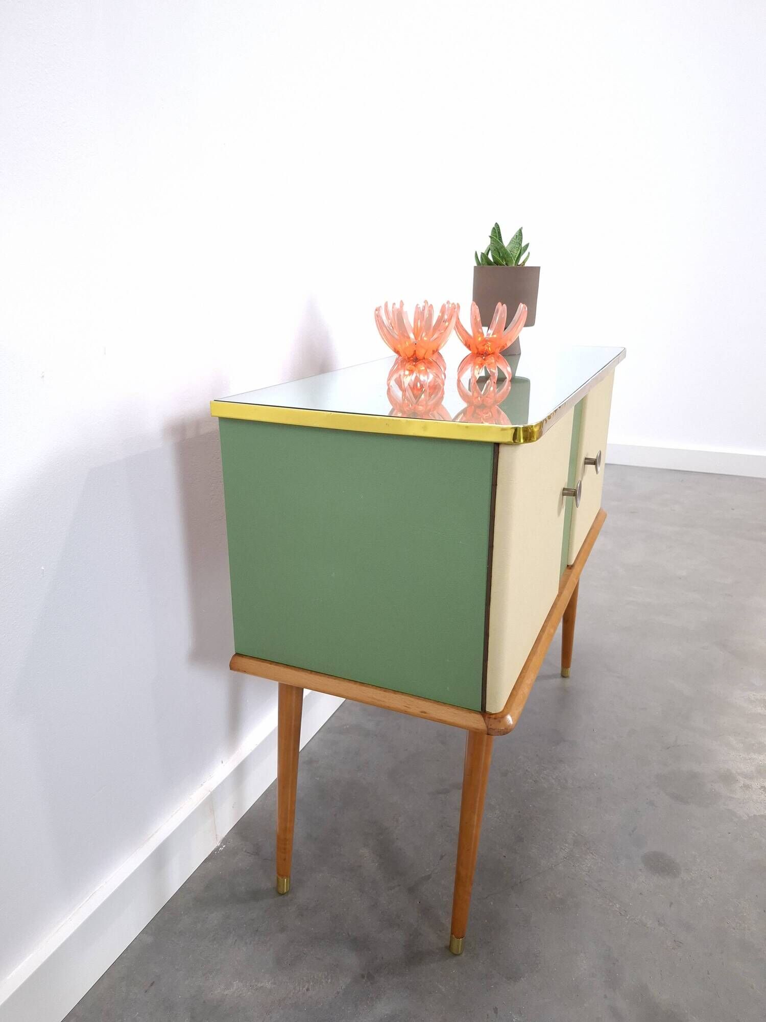 Vintage green DDR cabinet, model Libelle with glass top, slanted legs.