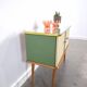 Vintage green DDR cabinet, model Libelle with glass top, slanted legs.