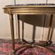 Table guéridon style Louis XVI en bois doré