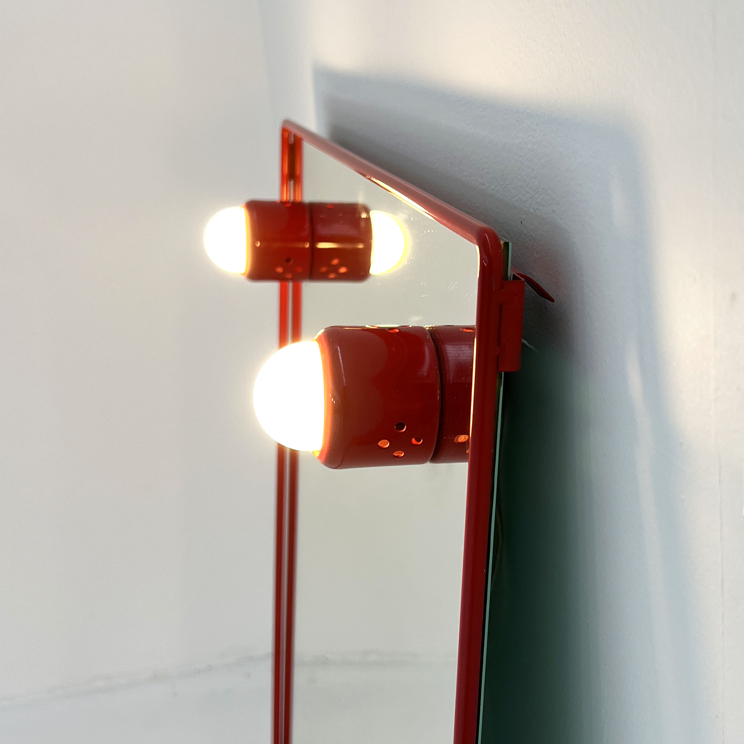 Mirror with red metal bulbs, 1970