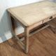 Antique farmhouse table in raw wood
