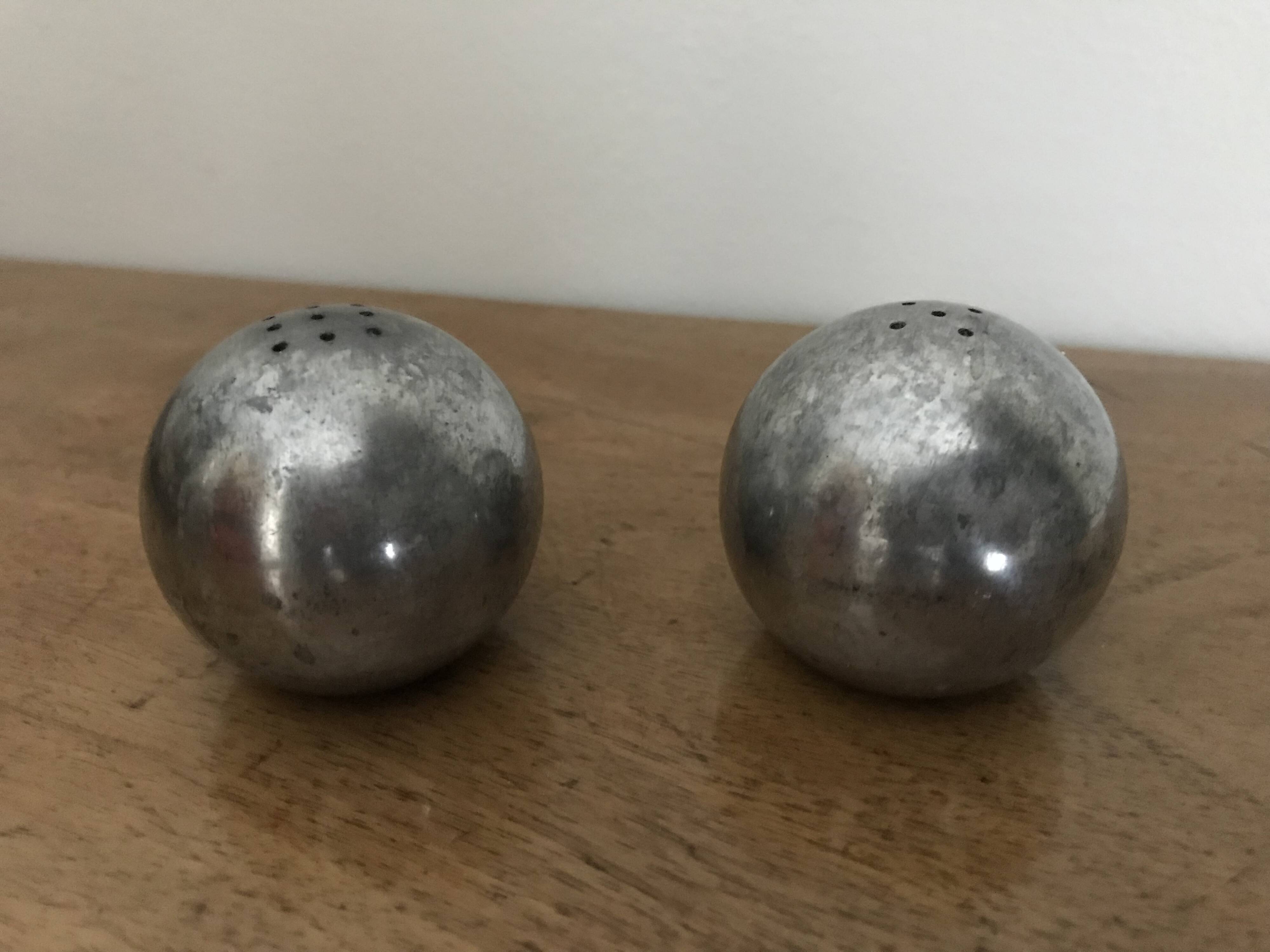 Brutalist salt and pepper ball in cast steel