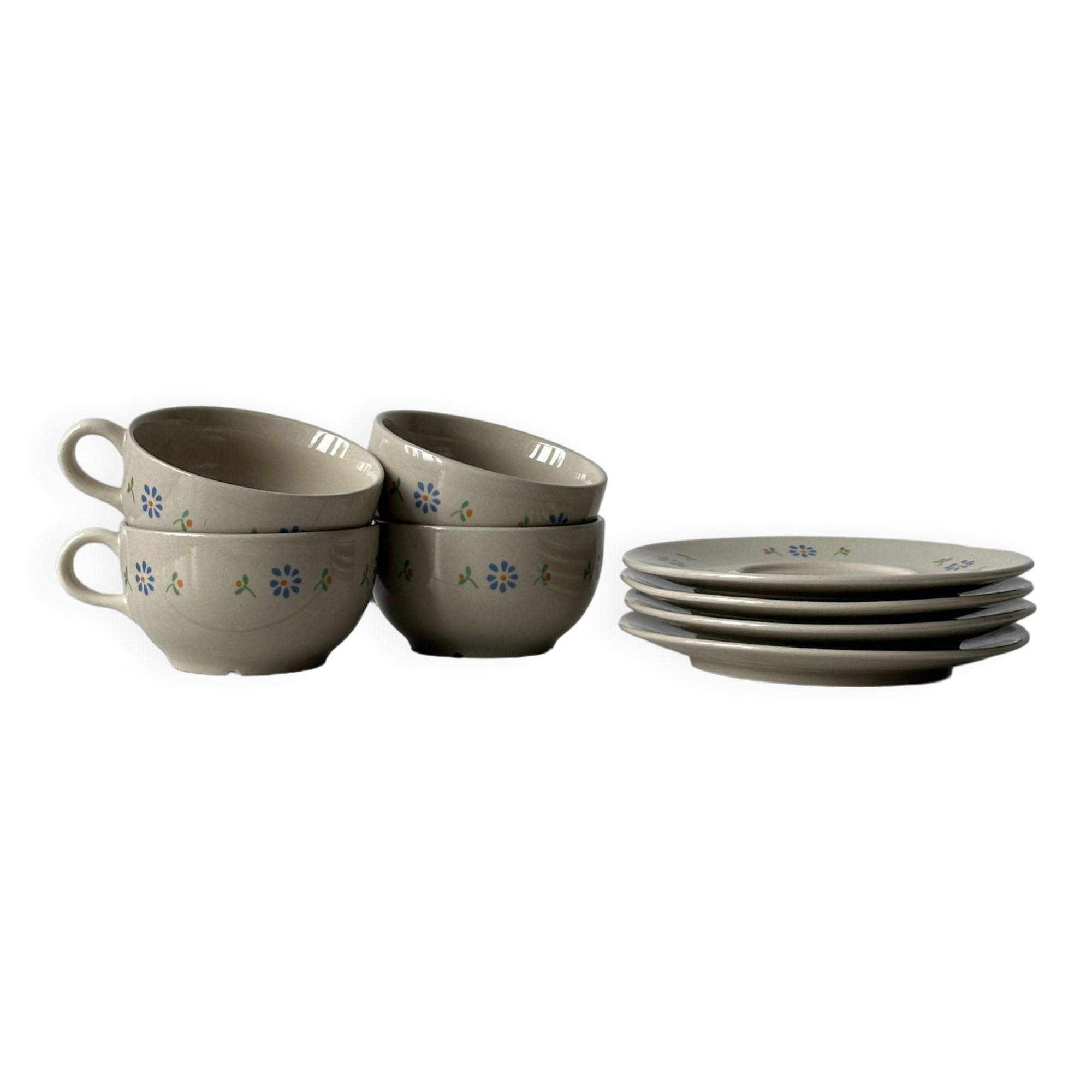 Ceramic cups and saucers with flower decoration