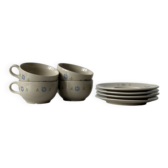 Ceramic cups and saucers with flower decoration