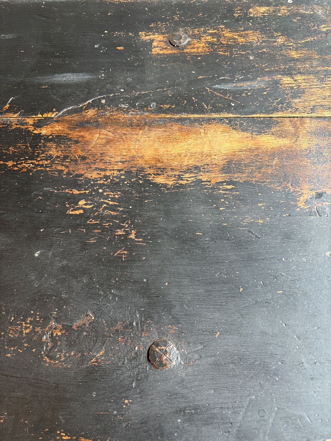 Solid wood farmhouse table with ebony finish.