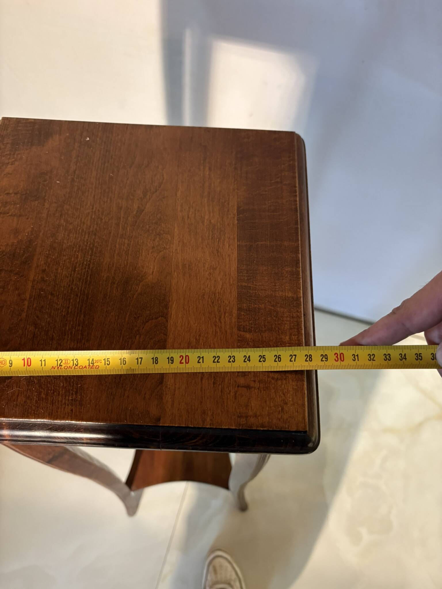 Vintage dark wood side table with curved base