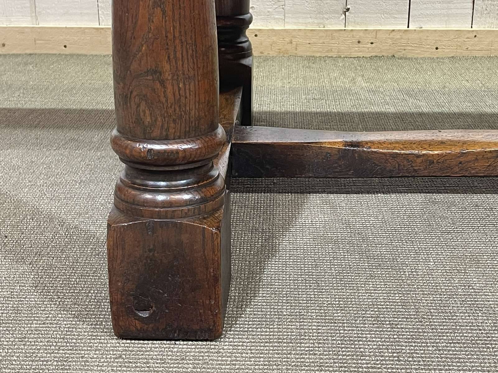 English monastery table with extensions from the late 19th century in elm and oak.