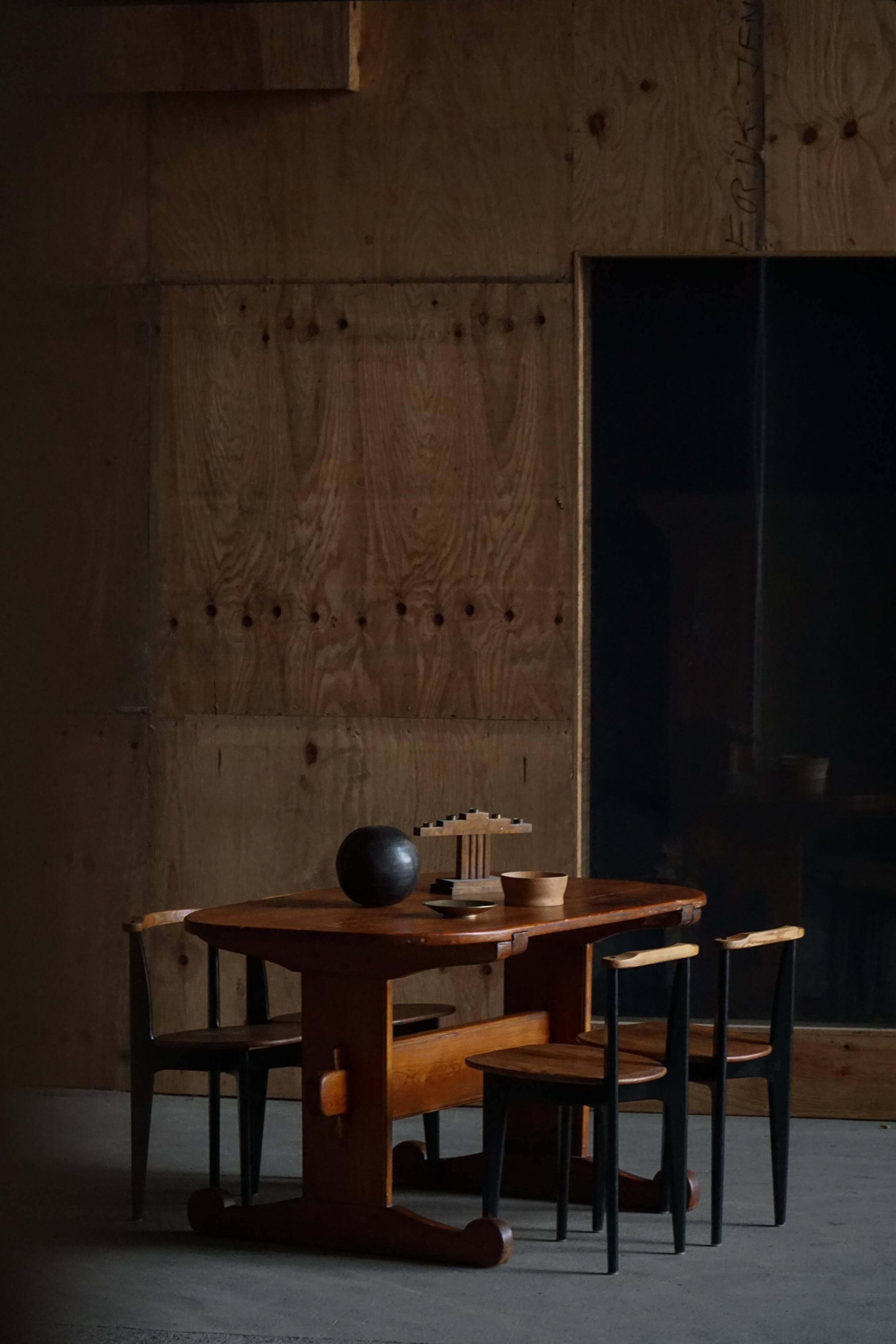 Primitive Swedish oval dining table in pine, early 20th century.