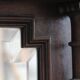 Imposing beveled mirror with wooden frame