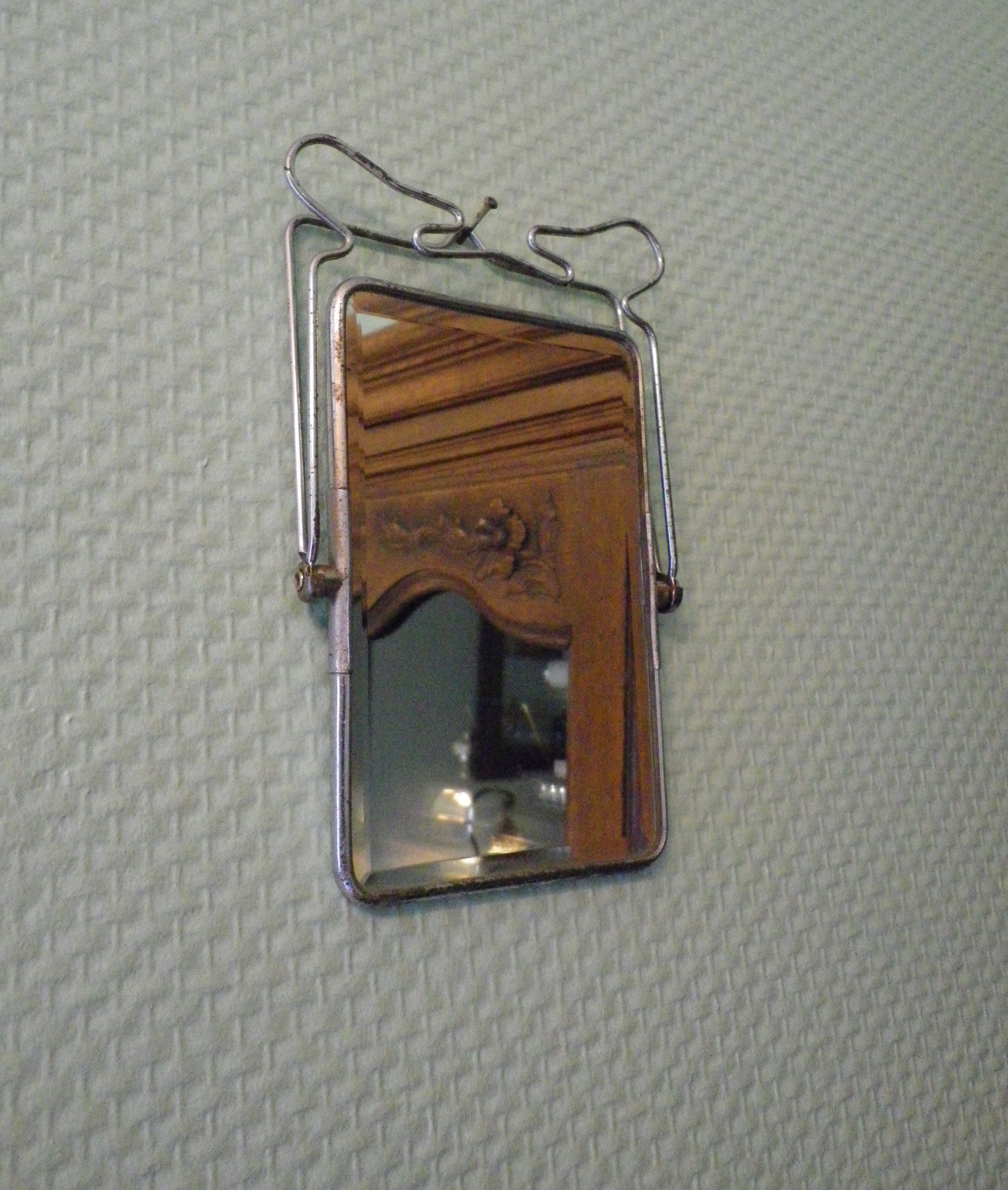 Two-foot barber mirror, suspension mode, beveled, chrome metal - 70s -