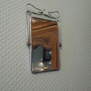 Two-foot barber mirror, suspension mode, beveled, chrome metal - 70s -