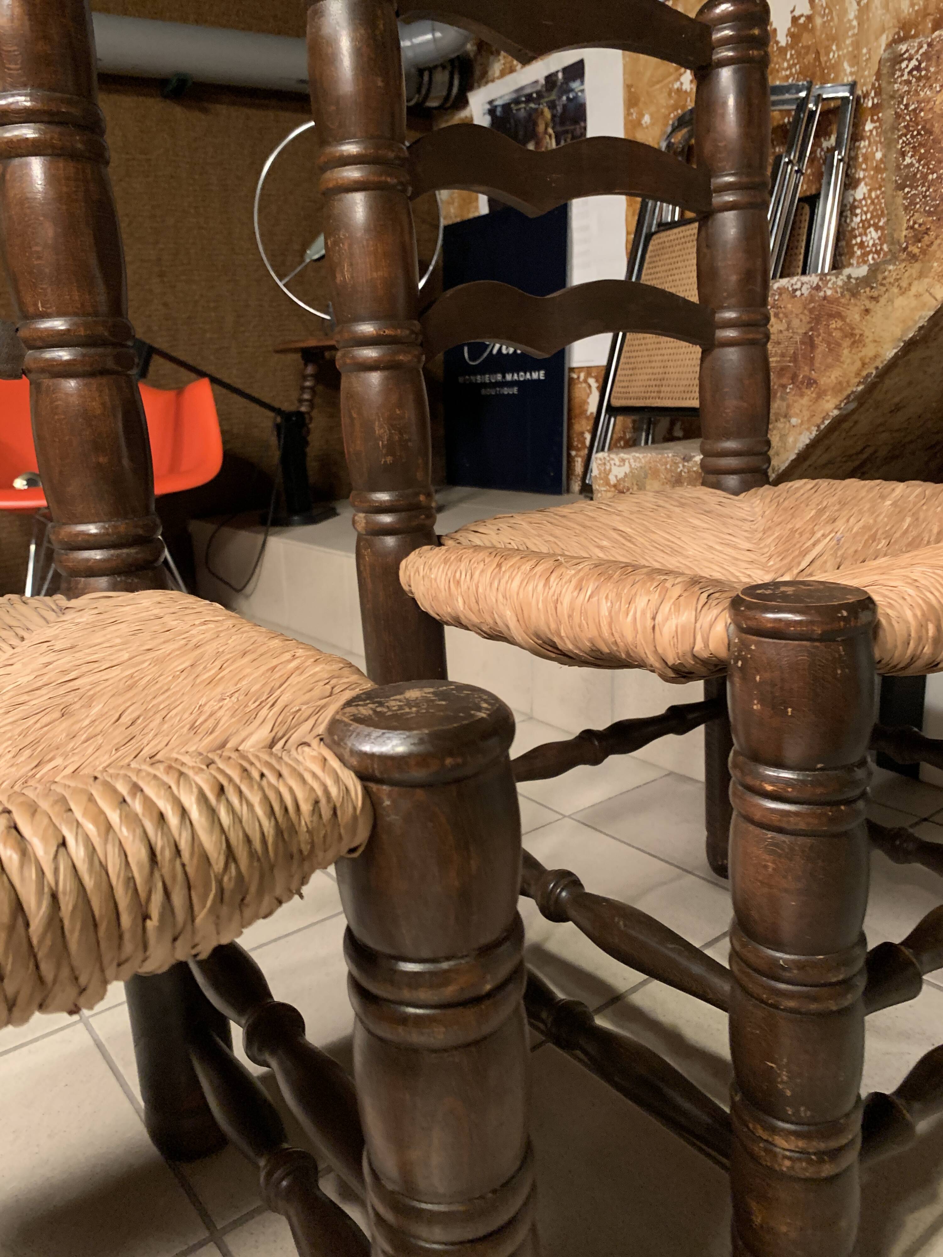 Pair of solid wooden chairs and mulched seat