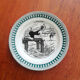 Old vintage dessert plate with drawing and phrase "swimming"