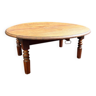 Round oak coffee table with drop leaves and turned legs